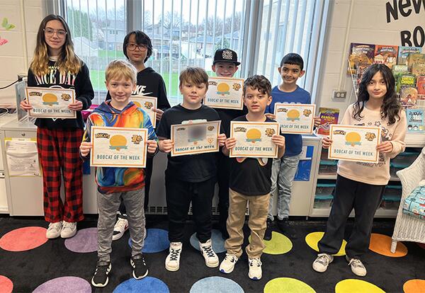 Bannes Bobcats for week of April 5 pose proudly with certificates