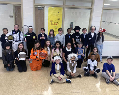 Third graders pose for Wax Museum picture dressed as famous people at Millennium Elementary
