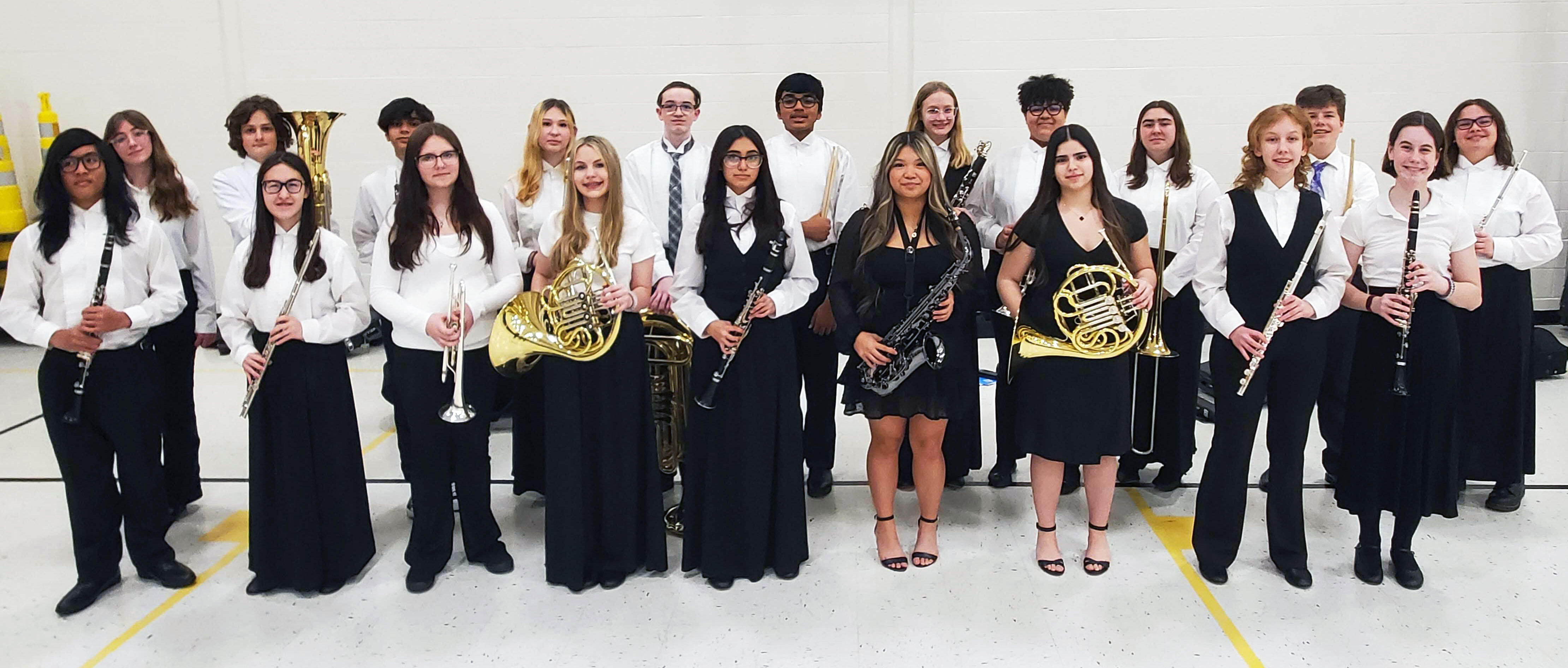KSD 140 Honor Band students pose proudly with instruments before concert performance