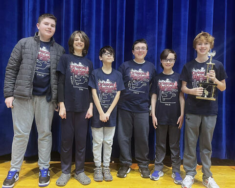 Grissom mathletes proudly pose with trophy won at SWIC Competition