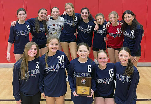 Grissom 6th/7th grade girls'volleyball team proudly pose with plaque after placing second in SWIC tournament